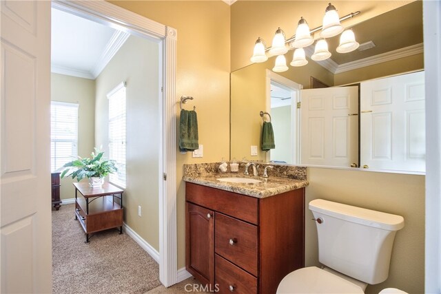 41548 Hutchison Ct, Murrieta, CA 92562 - bathroom with crown molding, toilet, vanity, baseboards, and a chandelier