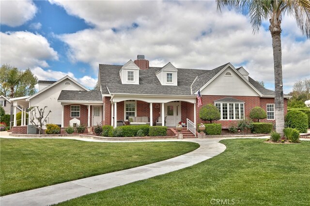 41548 Hutchison Ct, Murrieta, CA 92562 - view of front of house with brick siding, a front yard, a porch, a chimney, and roof with shingles