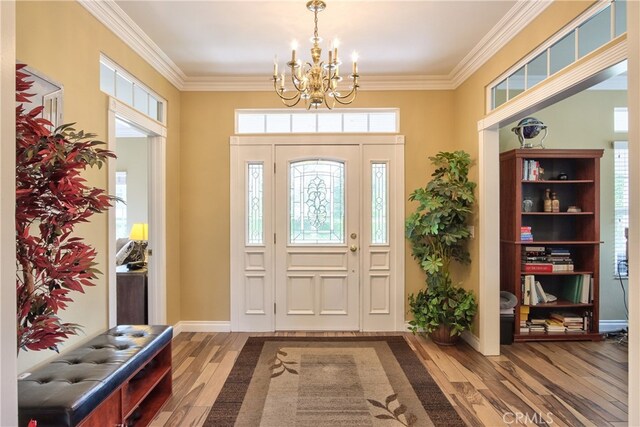 41548 Hutchison Ct, Murrieta, CA 92562 - foyer with a chandelier, wood finished floors, ornamental molding, and baseboards