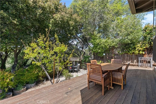deck featuring fence and outdoor dining area