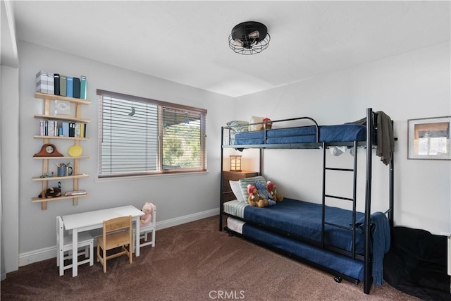 carpeted bedroom featuring baseboards