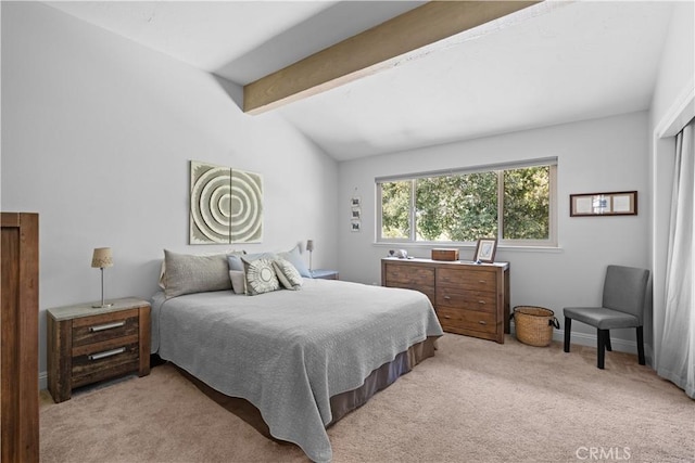 carpeted bedroom featuring vaulted ceiling with beams