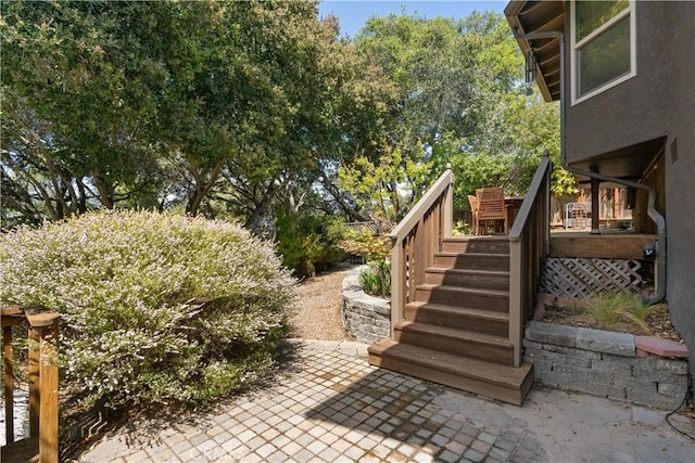 view of patio / terrace featuring stairway and a deck