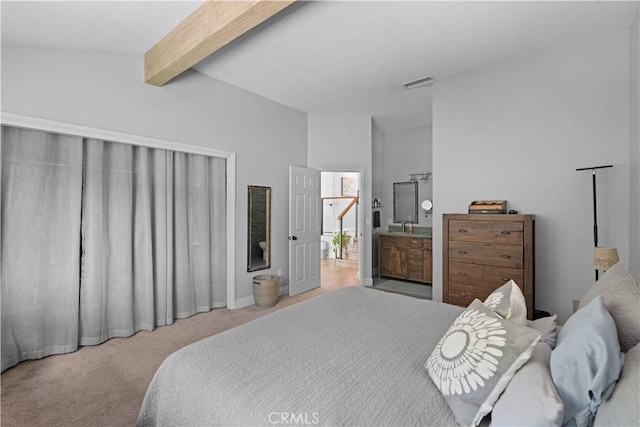 bedroom with visible vents, carpet flooring, and vaulted ceiling with beams
