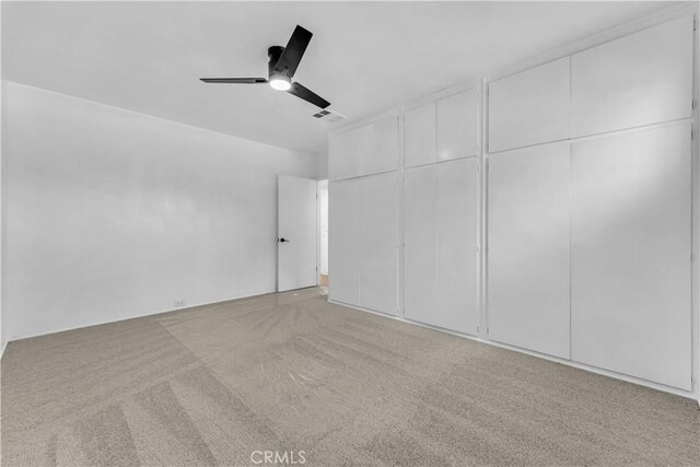 44546 E 3rd St E, Lancaster, CA 93535 - unfurnished bedroom featuring carpet flooring, ceiling fan, and two closets