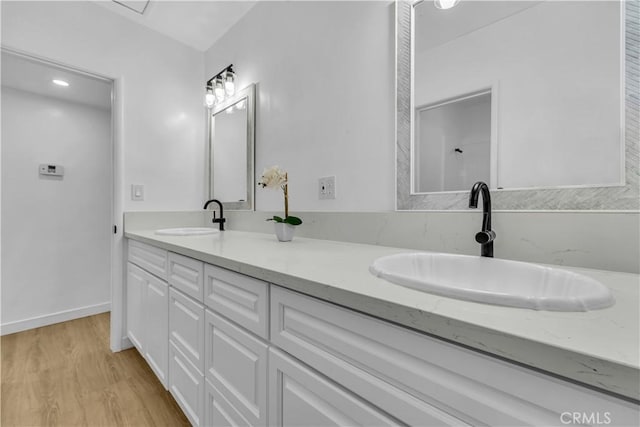 44546 E 3rd St E, Lancaster, CA 93535 - full bath with wood finished floors and double vanity
