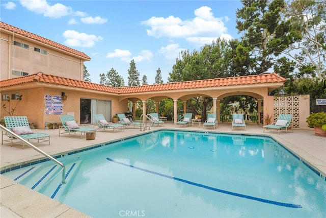 pool with a patio