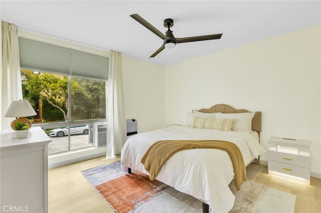 bedroom featuring ceiling fan and light wood-type flooring