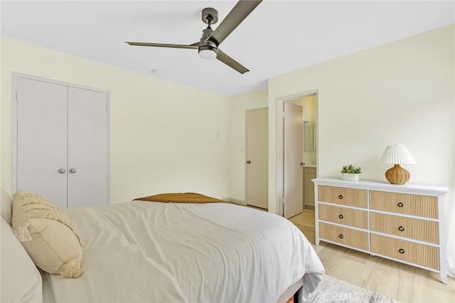 bedroom featuring a ceiling fan, a closet, ensuite bathroom, and light wood finished floors