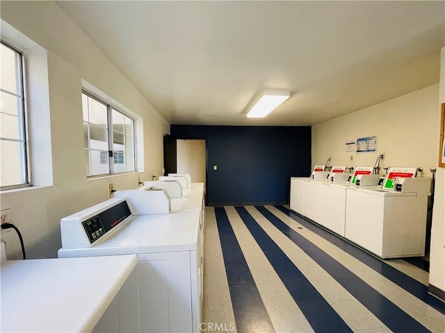 shared laundry area featuring washer and clothes dryer