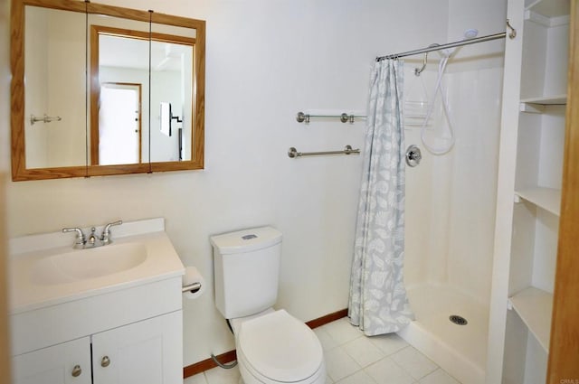 full bathroom with a shower stall, vanity, tile patterned flooring, toilet, and baseboards
