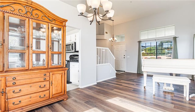 2773 W Summerset Dr, Rialto, CA 92377 - entryway with a chandelier, dark wood-style floors, and stairs