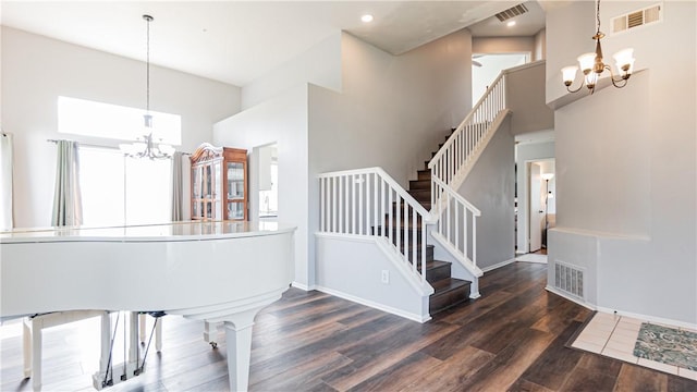 2773 W Summerset Dr, Rialto, CA 92377 - staircase with a chandelier, a towering ceiling, wood finished floors, baseboards, and recessed lighting