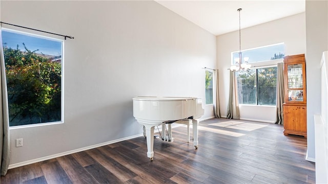 2773 W Summerset Dr, Rialto, CA 92377 - dining area featuring wood finished floors, a chandelier, baseboards, and a high ceiling