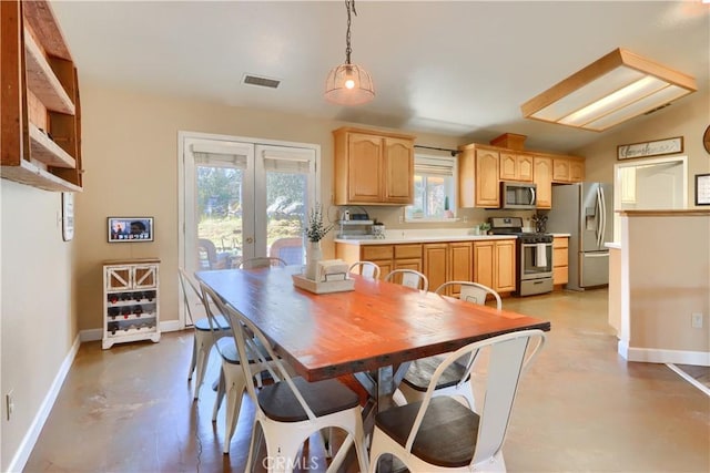 dining area with baseboards, concrete floors, visible vents, and french doors