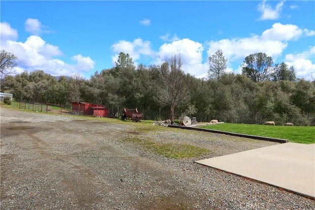 surrounding community featuring a lawn and fence