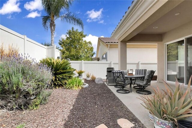 view of patio / terrace featuring a fenced backyard and outdoor dining area