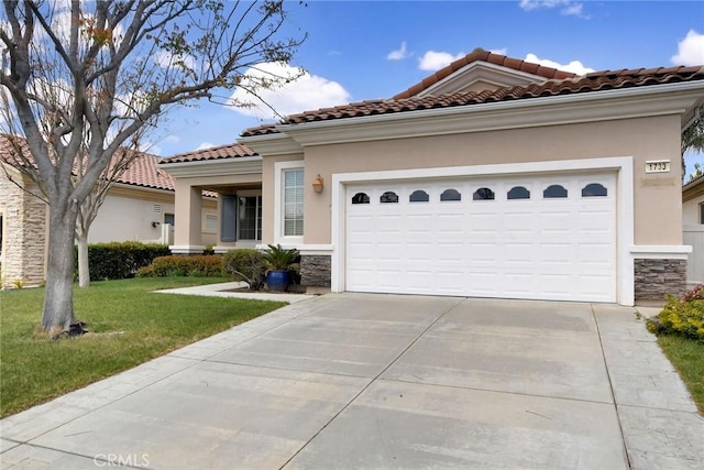 mediterranean / spanish-style home featuring stone siding, an attached garage, a front yard, a tile roof, and driveway