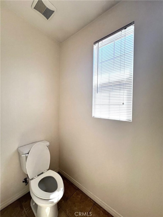 2866 S Via Belamaria, Ontario, CA 91762 - bathroom featuring baseboards, toilet, tile patterned flooring, and visible vents