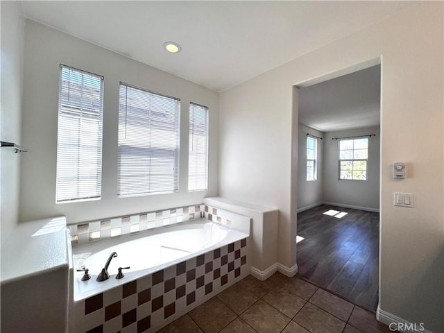 2866 S Via Belamaria, Ontario, CA 91762 - full bathroom featuring a garden tub, tile patterned floors, and baseboards