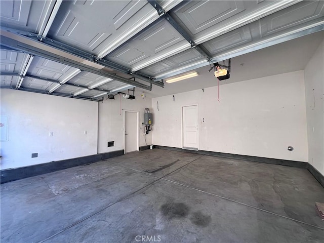 2866 S Via Belamaria, Ontario, CA 91762 - garage featuring a garage door opener and baseboards