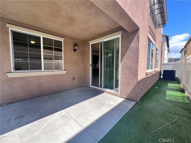 2866 S Via Belamaria, Ontario, CA 91762 - entrance to property with fence, a patio area, central AC, and stucco siding