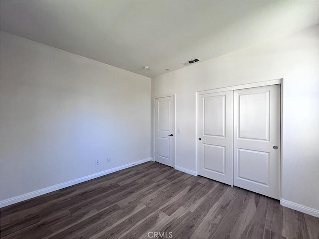 2866 S Via Belamaria, Ontario, CA 91762 - unfurnished bedroom with a closet, dark wood finished floors, visible vents, and baseboards
