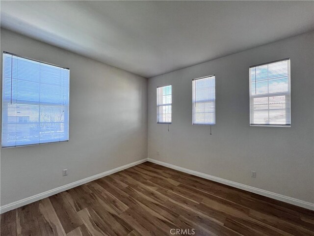 2866 S Via Belamaria, Ontario, CA 91762 - unfurnished room with baseboards and dark wood finished floors