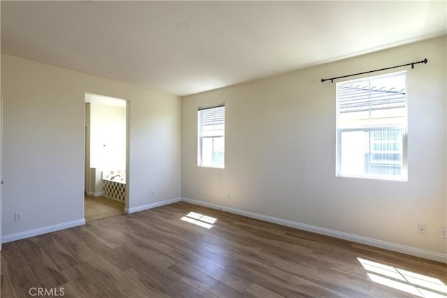2866 S Via Belamaria, Ontario, CA 91762 - spare room with baseboards and wood finished floors