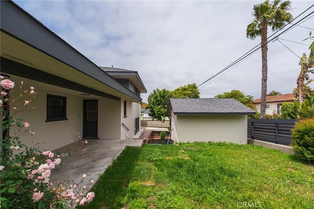 view of yard with fence and a patio area