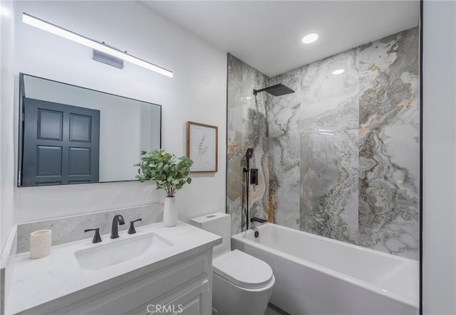 bathroom with recessed lighting, vanity, bathtub / shower combination, and toilet
