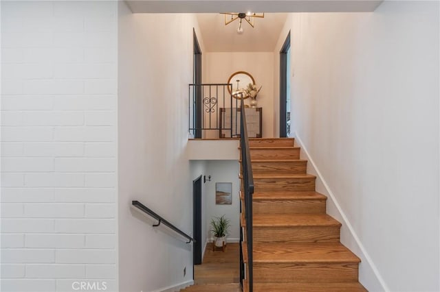 stairway with wood finished floors