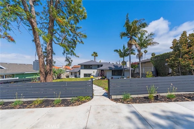 exterior space with a residential view and driveway