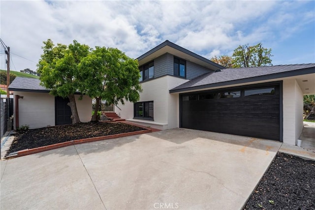 view of front of house featuring an attached garage and driveway