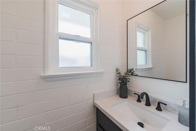bathroom featuring vanity and a wealth of natural light