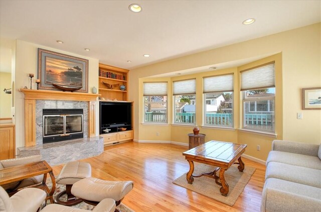 347 Ivar St, Cambria, CA 93428 - living room featuring baseboards, a healthy amount of sunlight, and light wood-type flooring