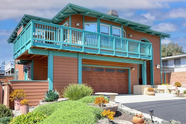 347 Ivar St, Cambria, CA 93428 - view of front of home featuring a garage and aphalt driveway