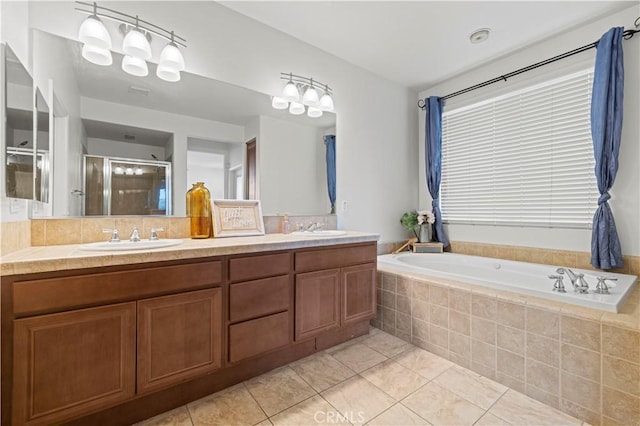 32177 Clear Springs Dr, Winchester, CA 92596 - full bathroom with tile patterned floors, double vanity, a shower stall, and a garden tub