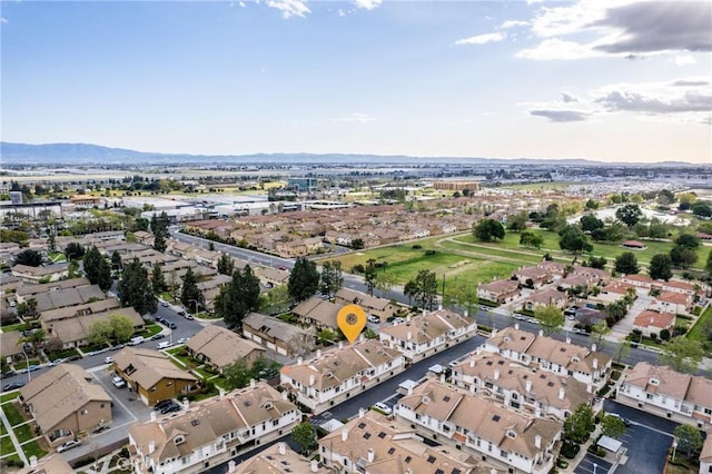 drone / aerial view with a mountain view and a residential view