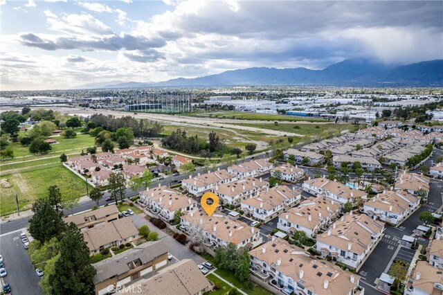 drone / aerial view featuring a residential view and a mountain view
