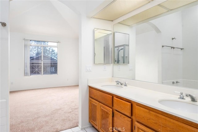 bathroom featuring double vanity and a sink