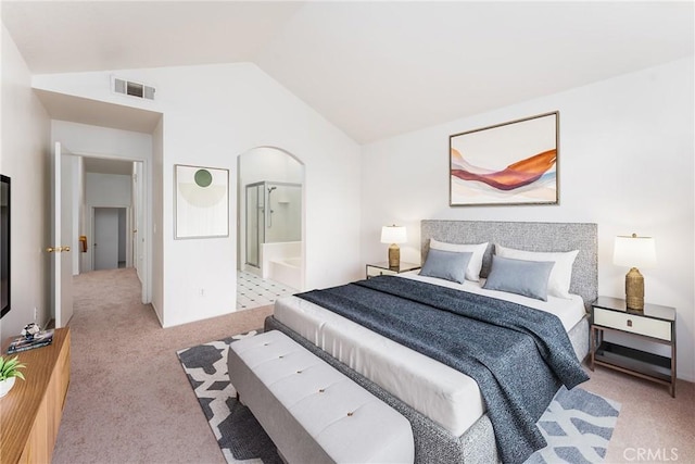bedroom with lofted ceiling, light colored carpet, visible vents, and arched walkways