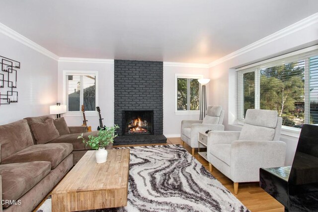 3447 Burritt Way, La Crescenta, CA 91214 - living room featuring a brick fireplace, crown molding, and wood finished floors