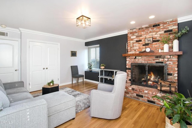3447 Burritt Way, La Crescenta, CA 91214 - living area featuring wood finished floors, a brick fireplace, crown molding, baseboards, and recessed lighting