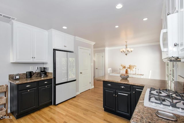 3447 Burritt Way, La Crescenta, CA 91214 - kitchen with white appliances, white cabinetry, crown molding, light wood-style flooring, and a chandelier