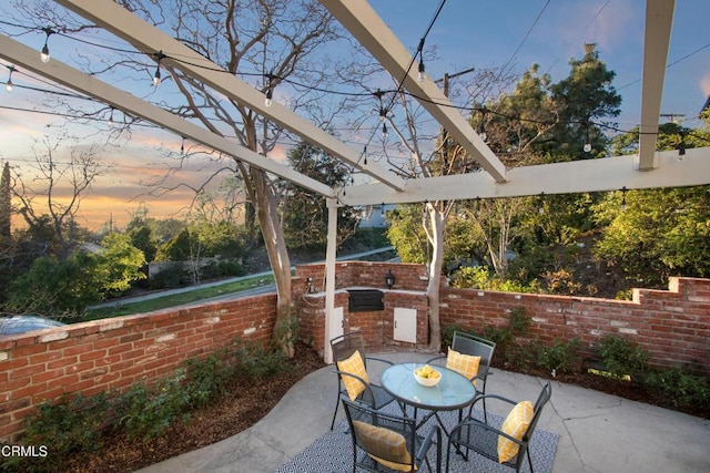 3447 Burritt Way, La Crescenta, CA 91214 - patio terrace at dusk featuring an outdoor kitchen, a patio, and outdoor dining space