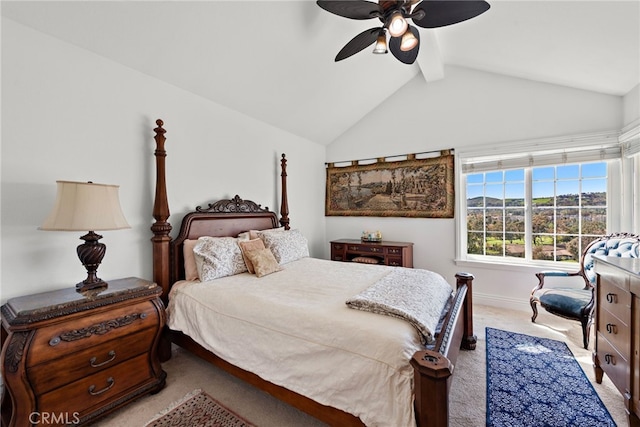 bedroom featuring a ceiling fan, vaulted ceiling with beams, and carpet floors