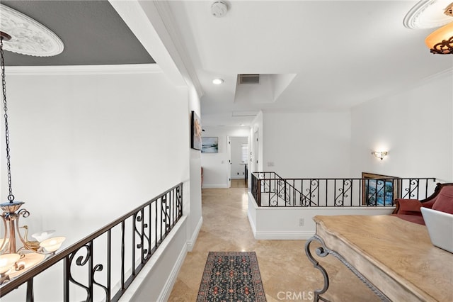 hall featuring an upstairs landing, recessed lighting, visible vents, crown molding, and a notable chandelier
