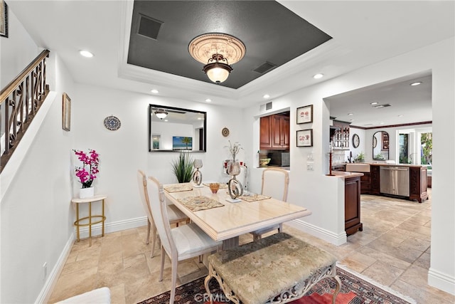 dining space featuring recessed lighting, stone tile flooring, baseboards, visible vents, and a raised ceiling