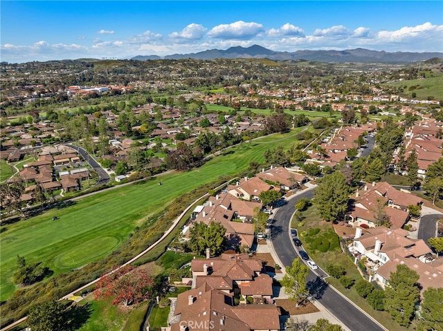 aerial view with a mountain view, golf course view, and a residential view